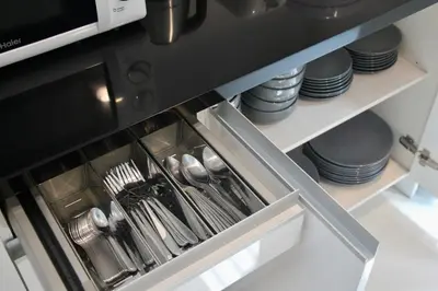 a kitchen with dishes and utensils on a shelf at Entire 3BR Townhome, Pool, Sukhumvit, BTS&MRT Asok in Bangkok
