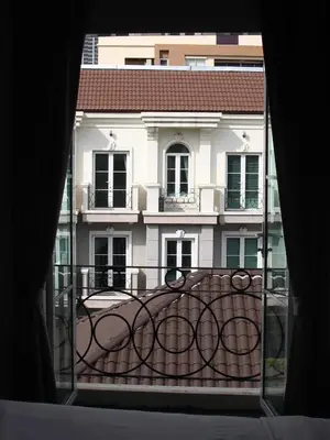 a view of a building from a balcony at Entire 3BR Townhome, Pool, Sukhumvit, BTS&MRT Asok in Bangkok