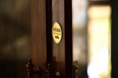 a wooden door with a push sign on it at Wallaya Heritage Stay in Bangkok