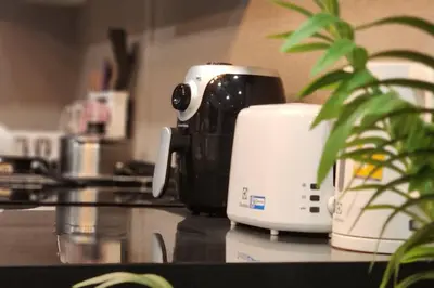 a toaster sitting on top of a kitchen counter at SelfCheckIn The State Tower RiverView 2Bedroom BTS ICONSIAM Silom Sathon in Bangkok