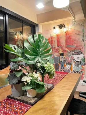 a table with potted plants on top of it at Double Studio, Private Bath & Balcony, Shared Kitchen with Local Family by Pillows & Purrs in Bangkok