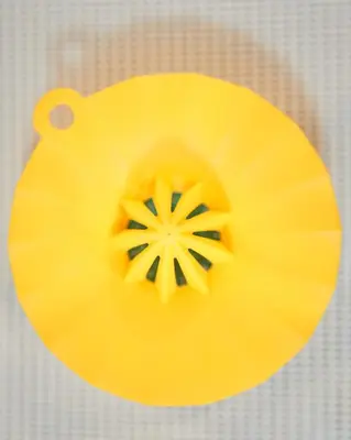 a close up of a yellow flower on a table at Spacious Design Loft with Rooftop in Bangkok
