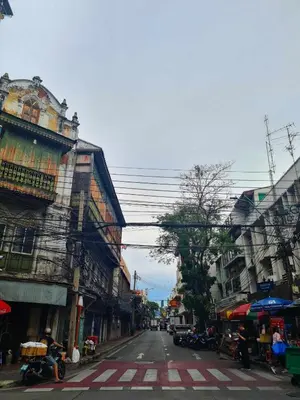 an empty street in an asian city with buildings at Cozy Gallery Studio at Chinatown in Bangkok
