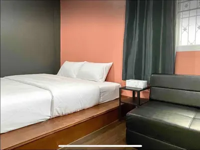 a bedroom with a white bed and a window at Purple House King BR Walk to Grand Palace in Bangkok