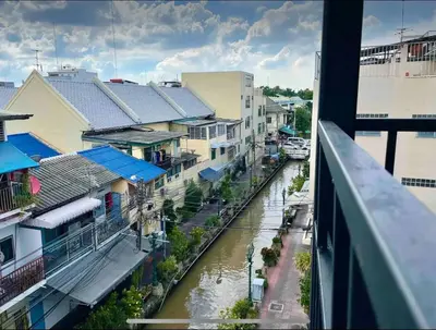 a view of a river with buildings and a city at Purple House King BR Walk to Grand Palace in Bangkok