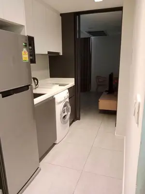 a kitchen with a washer and a washing machine at Circle S Sukhumvit12 NearBTS,MRT in Bang Kapi