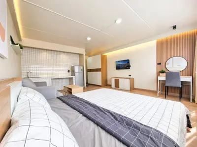 a large bedroom with a large bed and a desk at BetterRoom เมืองทองธานี C6 in Pak Kret