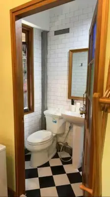 a bathroom with a toilet and a sink at T-house 10 -6BR Max15ppl whole house with pool in Bangkok