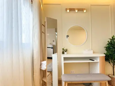 a small bathroom with a mirror and a stool at ห้องพักเมืองทองธานี Happiness Sleep P1 in Ban Song Hong