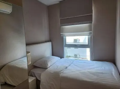 a bedroom with a bed and a window at Condominium - Sukhumvit Soi 5 BTS Nana- Room Size 50m2 in Bangkok