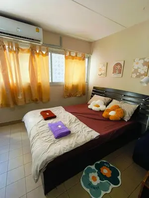 a bedroom with two beds with stuffed animals on them at SimpleRoomDesign, VeryClose Impact Muaungthongthani in Thung Si Kan