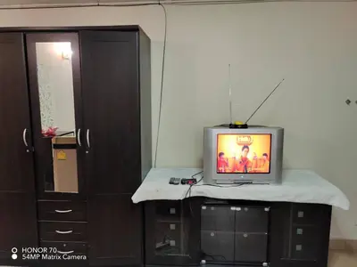 a television sitting on a counter in a room at SimpleRoomDesign, VeryClose Impact Muaungthongthani in Thung Si Kan