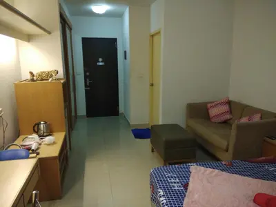 a small room with a bed and a couch at Savi Rooms Super Deluxe Studio 2 Nr Bkk Hospital in Bangkok