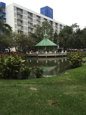 a gazebo in a park in front of a building at Savi Rooms Super Deluxe Studio 2 Nr Bkk Hospital in Bangkok