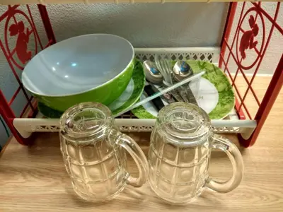 a tray with dishes and utensils on a table at Savi Rooms Super Deluxe Studio 2 Nr Bkk Hospital in Bangkok