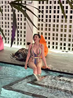 a woman in a bikini standing in a swimming pool at \u66fc\u8c37\u6cf0\u5883\u5962\u5922\u5225\u5885 in Ban Nong Rong (1)