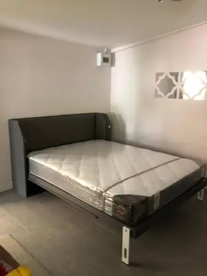 a bed in a room with a bed frame at Silver Room Guest House Very Close Bangkok Hospital in Bangkok