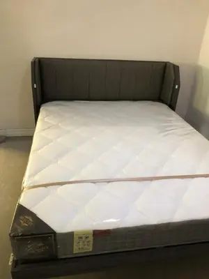 a bed in a room with a white mattress at Silver Room Guest House Very Close Bangkok Hospital in Bangkok