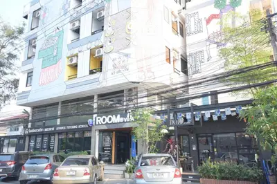a building with cars parked in front of it at Room@Vipa in Bangkok