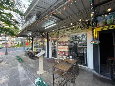a restaurant with tables and chairs outside of it at 3A-168 House Near BTS-icon siam in Godown