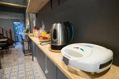 a toaster sitting on top of a kitchen counter at Assembly Hostel in Bangkok