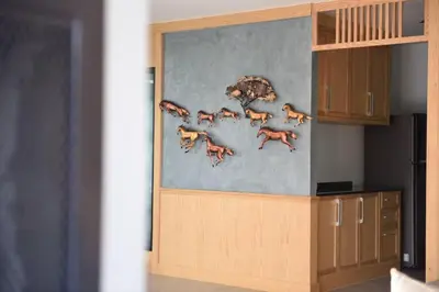 a wall with a painting of foxes on it at Home Inn Hotel in Bangkok