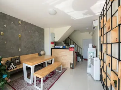 a room with a bench and a table in it at 5 Diamond in Bangkok