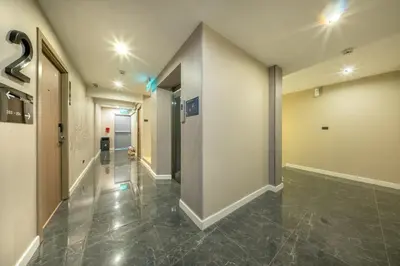 a hallway in a building with a hallway at Ralph Poshtel Pratunam in Bangkok