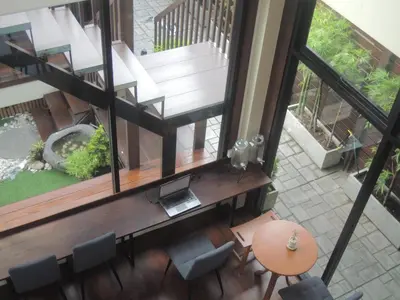 an overhead view of a house with a staircase and chairs at Aiims Tales Canal Boutique House in Bangkok