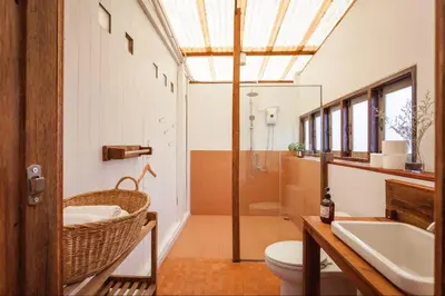 a bathroom with a sink and a toilet and a shower at Mana Craft Stay in Bangkok