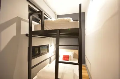 a bunk room with two bunk beds in it at Bangkok Silom chat box hostel in Bangkok