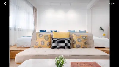 a living room with a couch with pillows at 168 House 3B Near BTS iconsiam in Godown