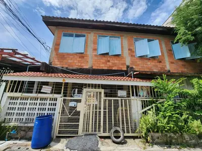 a house with a bird cage in front of it at 109 Homely Apartment Free Wi-Fi Near BTS in Bangkok