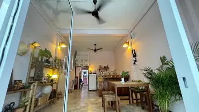 a dining room with a table and chairs at Baan YentaFo - Pink House 2nd floor in Chinatown