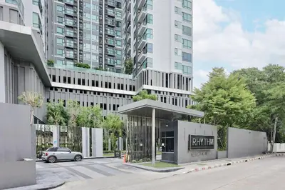 a car parked in front of a tall building at 5mins walk to BTS Thonglor, easy access 1 bedroom in Bangkok