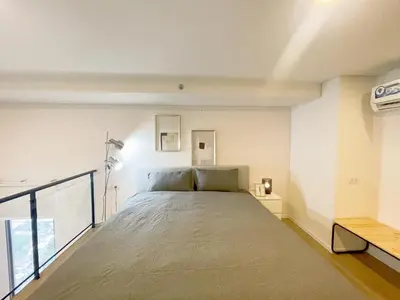 a large bed in a room with a window at 2BR BTS On Nut Siamese87 Two Bedroom LOFT hight floor 24 in Bangkok