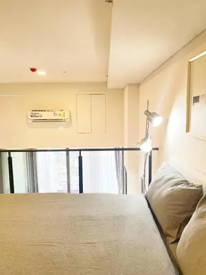 a bedroom with a bed and a window at 2BR BTS On Nut Siamese87 Two Bedroom LOFT hight floor 24 in Bangkok