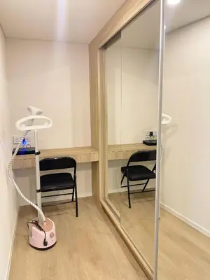 a dressing room with a mirror and a chair at 2BR BTS On Nut Siamese87 Two Bedroom LOFT hight floor 24 in Bangkok