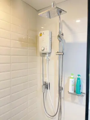 a shower with a shower head in a bathroom at 2BR BTS On Nut Siamese87 Two Bedroom LOFT hight floor 24 in Bangkok