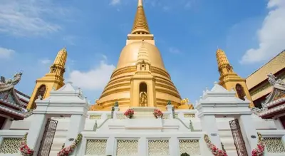 a large golden pagoda in a building at The Street Hostel Bangkok in Bangkok