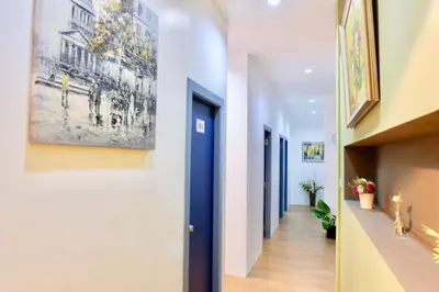 a hallway of a building with a painting on the wall at Sleep cafe @ Hidee in Bangkok