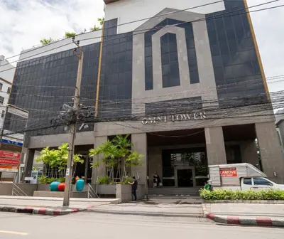 a building with a sign on the front of it at BUA Suite Sukhumvit, Nana BTS in Bangkok