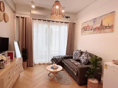 a living room with a couch and a table at Great relaxing in oldtown, Entire floor, near Grand Palace in Bangkok