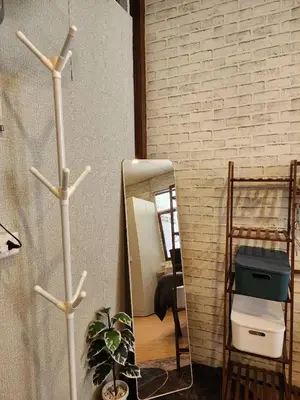 a bathroom with a mirror and a plant and a shelf at 207-Olan Place Homely room Free Wi-Fi and Near BTS line in Bangkok