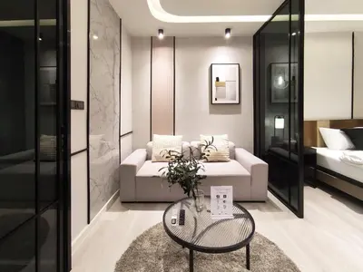 a living room with a couch and a table at Luxe Design l Wellness & Tropical Retreat l No fee in Bangkok