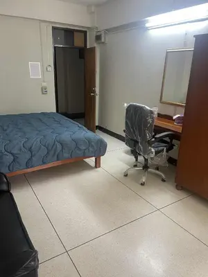a room with a bed and a desk and a chair at Viriyapon first floor2 in Bangkok