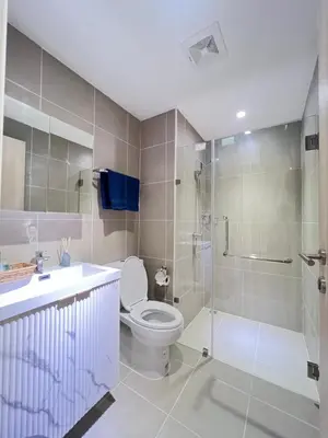 a bathroom with a toilet and a shower and a sink at The Forest Building A-more than3nights stay-self checkin checkout in Bangkok