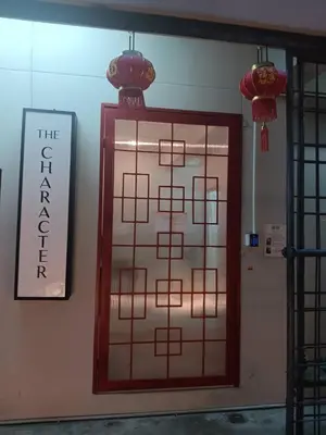 a door in a room with a sign on the wall at The Character China Town เดอะ คาแรคเตอร์ เยาวราช Mrt วัดมังกร Pro in Khlong San