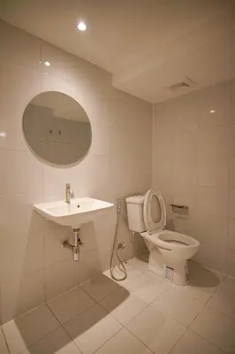 a bathroom with a toilet and a sink at ABC Bangkok RCA in Bangkok