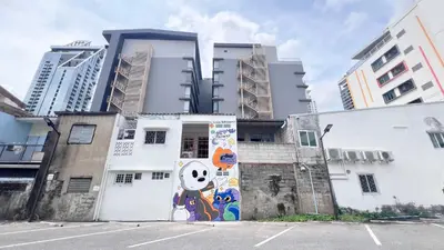 a building with a mural on the side of it at uouRangnamHouse in Bangkok